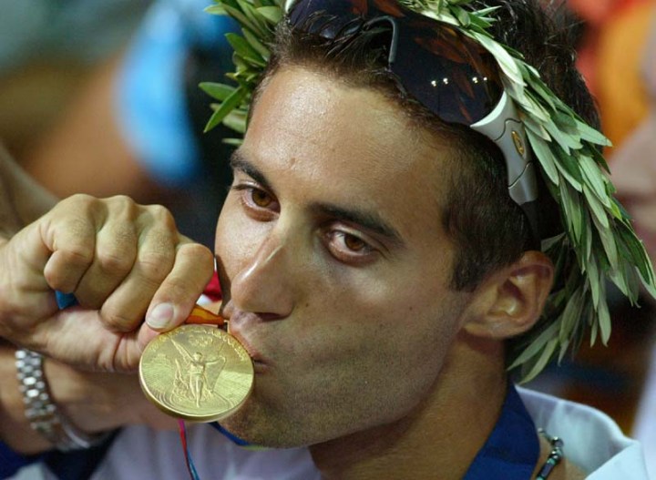 Israel's Gal Fridman kisses his Gold medal after the Men's Mistral windsurfer sailing event at the 2004 Olympic Games in Athens, Greece, Wednesday Aug. 25, 2004. Fridman won the first gold medal for Israel at the Olympic Games ever. (AP Photo/Herbert Knosowski)